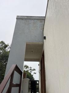 an entrance to a building with a door open at Lofts in the heart of Rosa in Imbituba
