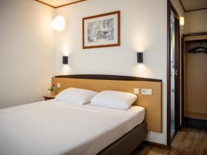 Postel nebo postele na pokoji v ubytování Campanile Hotel & Restaurant Gent