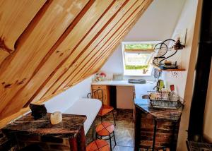a small room with a desk and a table at Kaszubskie Piramidy in Borzytuchom