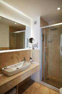 a bathroom with a sink and a shower at Flow Datca Surf & Beach Hotel in Datca