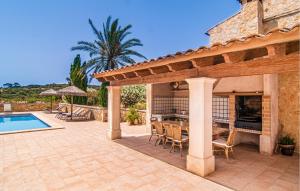 a patio with a table and chairs next to a pool at Cas Cuni in Felanitx +38 photos