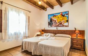 a bedroom with a large bed and a window at Cas Cuni in Felanitx