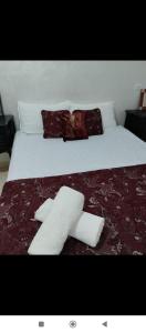 a bed with two rolls of paper towels on it at Araucaria in Oualidia