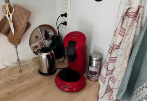 a counter top with a coffee maker and a blender at La Petite demeure in Le Hohwald
