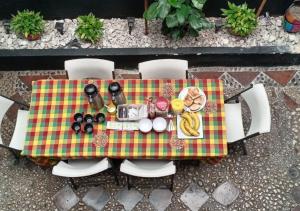 a table with a platter of food on it at Villa Candelaria Hostel in Bogotá
