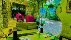 a living room with a couch and a table at parachichi house Bed and Breakfast in Arusha