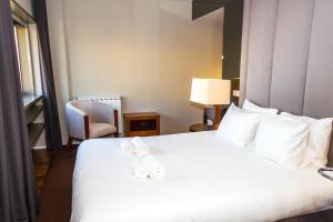 Voodi või voodid majutusasutuse Liiiving in Matosinhos - High Sea Condo toas