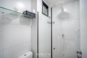 a bathroom with a shower and a toilet at Apart in Condo w/ Pool and Gym STE0312 in Salvador