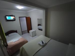 Postel nebo postele na pokoji v ubytování Hotel Abada
