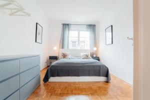 Ένα ή περισσότερα κρεβάτια σε δωμάτιο στο 3 BR - Familienfreundlich - Geräumig - Zentral - Parkplätze