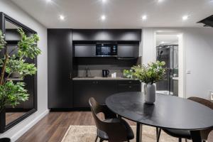 a dining room with a table and chairs at E41 - Trendy Boutique Apartments - Prime Spot by BQA in Budapest