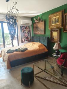 a bedroom with a bed and a glass table at Garden Art in Pervolia +32 photos