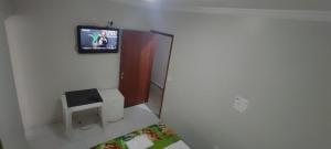 TV a/nebo společenská místnost v ubytování Hotel Abada