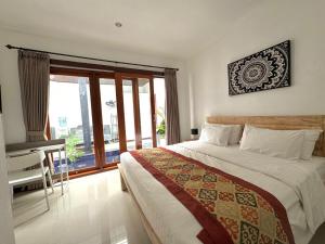 En eller flere senge i et værelse på CWB Villa