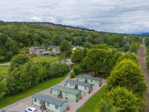 an aerial view of a village with houses and trees at Lodge 3 in Carnforth