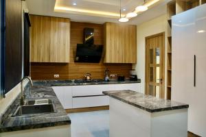 a kitchen with a sink and a counter top at 5 Bedroom semi detached Apartment by Ellestar Homes in Lekki