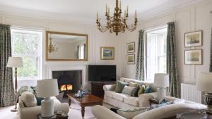 a living room with two couches and a television at The Tower, Keith Marischal in Humbie
