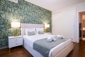 Giường trong phòng chung tại Lux City center apartments EX