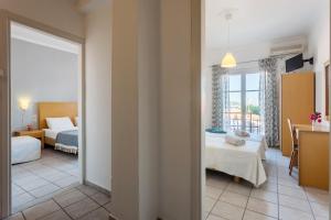 A bed or beds in a room at Argo Pension
