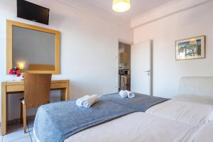 A bed or beds in a room at Argo Pension