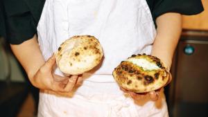a person holding two buns in their hands at SOIL Nihonbashi Hotel in Tokyo +30 photos