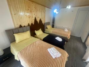 Postel nebo postele na pokoji v ubytování Nadia Guesthouse