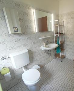 a bathroom with a toilet and a sink at Unterkunft Uni-nähe in Bochum +26 photos
