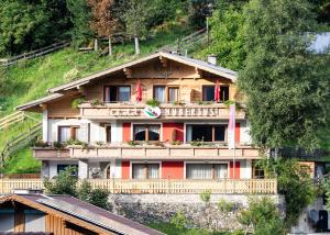 a building on the side of a hill at Chalet Ferienhaus Hubertus in Schladming