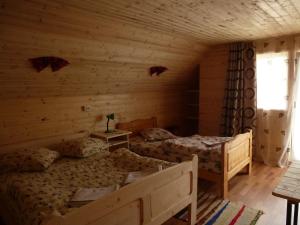 Postel nebo postele na pokoji v ubytování Cabana Ghetari