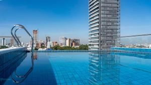 a swimming pool on the roof of a building at Elegant Suite in Santa Cruz de la Sierra