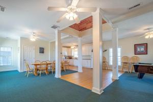 a dining room and living room with a pool table at Gnarly Wave 351 #103DS-H in Hatteras