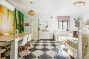 a living room with a table and a couch at A&N Pueblo Bahia in Algarrobo-Costa +45 photos