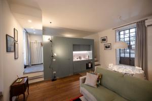 Katil atau katil-katil dalam bilik di Loft Moderno a 500m da Loreto M1 M2
