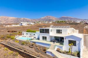 a white house in the middle of the desert at The View in Tías