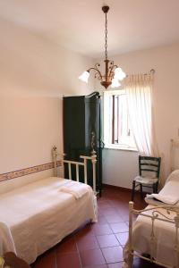 A bed or beds in a room at La Masseria