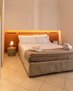 Postel nebo postele na pokoji v ubytování La Casetta di Giadapia - Apulia Houses & Flats