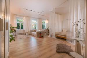 a living room with a couch and a table at KUKI Apartments in Trenčín