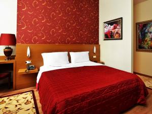 Postel nebo postele na pokoji v ubytování Hotel Austria
