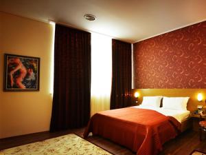 Postel nebo postele na pokoji v ubytování Hotel Austria