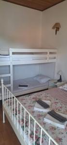 a white bunk bed in a room with a bed at Kuća za odmor Emanuela in Vodice