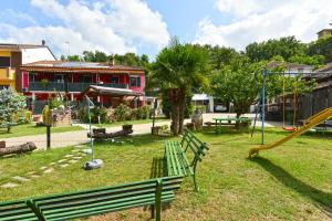 a park with a playground with a slide at CASA APPARTAMENTO VACANZE La fermata delle rondini in Castello di Annone