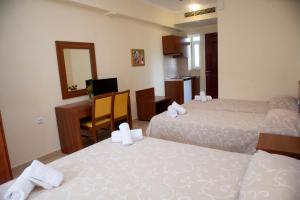 Postel nebo postele na pokoji v ubytování Summertime Inn