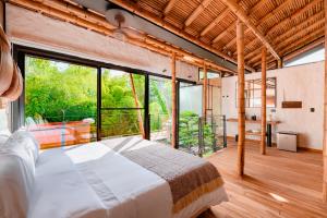 Ένα ή περισσότερα κρεβάτια σε δωμάτιο στο Kawa Bamboo Retreat
