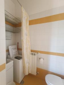 a laundry room with a washer and a washing machine at Maria Carolina Suite in Caserta