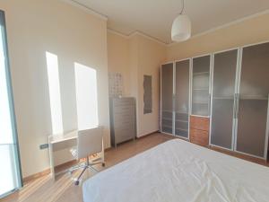 a bedroom with a bed and a desk and a chair at Maria Carolina Suite in Caserta +3 photos