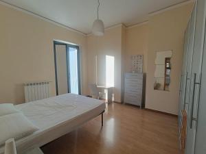 a bedroom with a bed and a desk in it at Maria Carolina Suite in Caserta