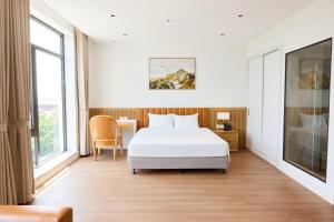 Ένα ή περισσότερα κρεβάτια σε δωμάτιο στο An Phát Luxury Hotel +18 φωτογραφίες