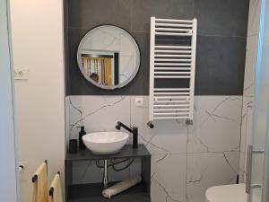 a bathroom with a sink and a mirror at Berto in Nerezine +47 photos