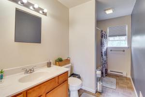 a bathroom with a sink and a toilet at Family Retreat with 2 Game Rooms and Deck in Long Pond in Long Pond +21 photos