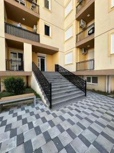 a building with stairs in front of a building at Casa Del Mar 2 in Shëngjin +2 photos